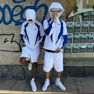 Streetwear color-block windbreaker jacket and shorts set for men and women, stylish hoodie.