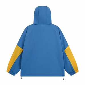 Detailed back view shot of the stylish blue and yellow colorblock hooded windbreaker jacket.