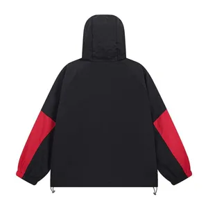 Detail view of black and red colorblock hooded windbreaker jacket casual outerwear.