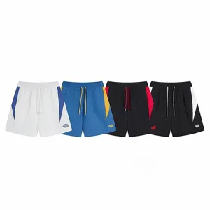 Detailed view of high street casual colorblock shorts with contrast side panels and drawstrings.