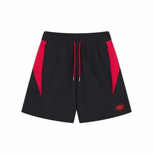 High street men women casual shorts with red side panels, drawstrings and embroidery details.