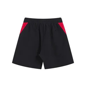 Casual black shorts with red side panel details, stylish high street summer sportswear.