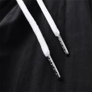 Close-up detail of casual apparel drawstring with metal tips, premium textile texture.