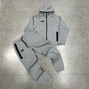 Grey fleece zip hoodie and sweatpants tracksuit set with pockets and hood for casual daily wear.