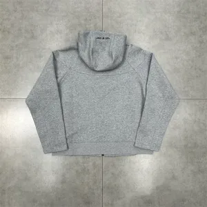 Grey fleece-lined zip-up hoodie for men and women, stylish back hood print streetwear.