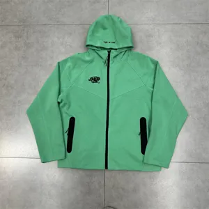 Green fleece-lined zip hoodie with chest embroidery and hooded text for casual daily wear.