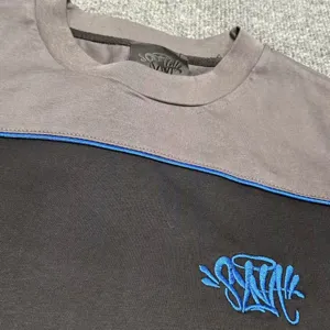 Men women colorblock short sleeve t-shirt with graffiti embroidery streetwear style.