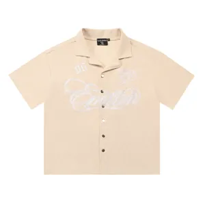Beige waffle knit short sleeve shirt with chic chest embroidery and lapel collar design.