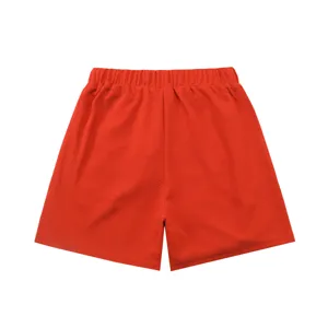 Red waffle knit shorts featuring a comfortable elastic waistband for daily casual wear.