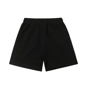 Black waffle knit casual shorts for men and women, comfortable elastic waistband design.