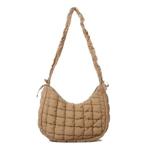 Detail view of the quilted puffy shoulder bag, showing soft cloud design and chic gathered strap.