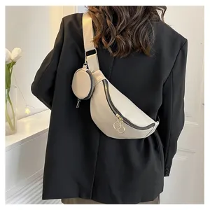 Vue détaillée du sac à bandoulière élégant en cuir PU avec petite poche ronde attachée.