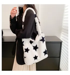 Fluffy black and white star pattern tote bag detail shot showing soft plush texture and large capacity.