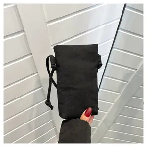 Petit sac bandoulière téléphone en toile noire, sac d'épaule décontracté et polyvalent pour femme.