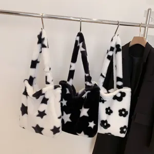 Fuzzy plush tote bag for women, stylish black and white star pattern casual shoulder bag.