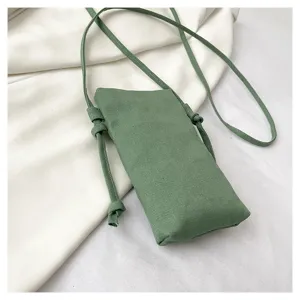 Sac bandoulière de téléphone en toile verte, design minimaliste idéal pour les loisirs.