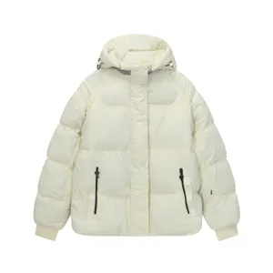 Detailed view of the white hooded puffer jacket, showcasing the zipper pocket and fabric texture.