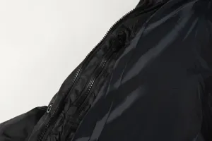 Close-up detail showcasing the sturdy black winter puffer jacket zipper and premium smooth inner lining.