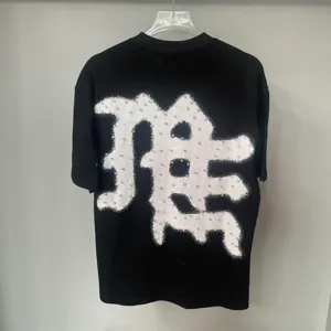 Back detail of American high street rhinestone letter print graphic short sleeve tee.