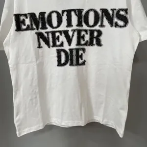 White streetwear graphic short sleeve t-shirt with trendy black rhinestone letters.