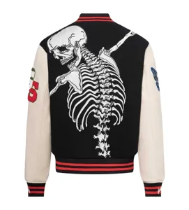 Detailed view of the streetwear black and white varsity jacket with skeleton embroidery.