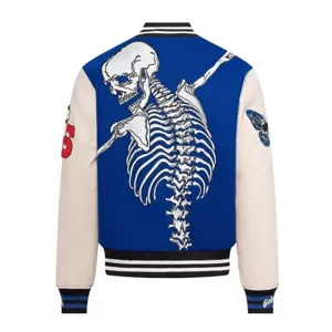 Unisex high street varsity jacket featuring striking skeleton embroidery and contrasting sleeves.