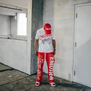 Trendy streetwear t-shirt and pants set featuring bold letter graphics and cupid prints.