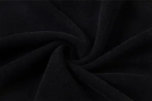 High quality black fabric texture detail view showing soft fleece material closeup for apparel manufacturing