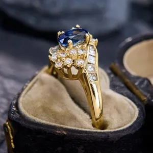 Vintage gold plated oval sapphire cluster ring with baguette side diamonds detail
