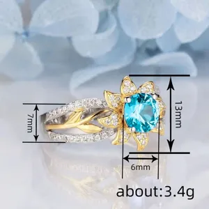 Sunflower simulated sapphire ring detail view showcasing floral design and sparkling crystal pave.