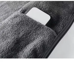 Close-up view of the soft fleece jacket pocket texture, comfortable warm winter fabric detail.