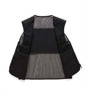 Detail view of black tactical mesh utility vest interior, breathable multi-pocket design
