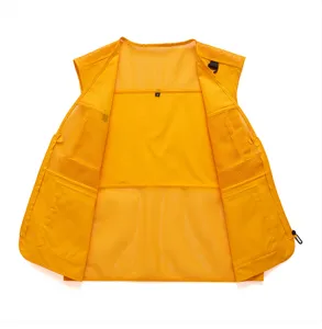 Yellow multi-pocket utility vest detail showing breathable mesh lining and structured design.