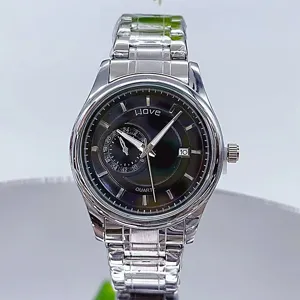 Detail view of men's stainless steel quartz watch with black dial and calendar display.