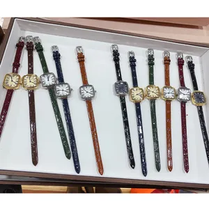 Detailed shot of vintage square dial quartz watches with colorful leather straps for women.