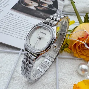 Detailed close-up of a silver square quartz women watch with elegant metallic strap.