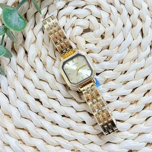 Detail shot of the vintage gold square quartz watch with exquisite metal steel strap.
