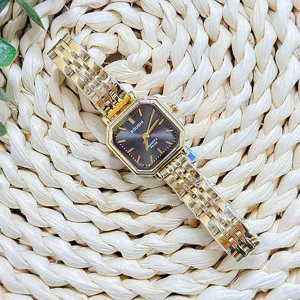 Detail view of the KOUSHI vintage gold quartz watch with a unique octagonal dial.