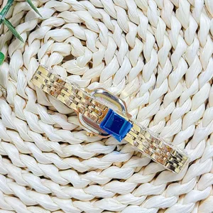 Vintage gold quartz watch for women, elegant metal strap timepiece with classic rectangular dial.