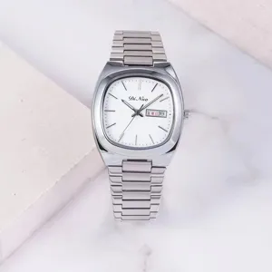 Silver stainless steel women watch detail view, elegant white dial with calendar display.