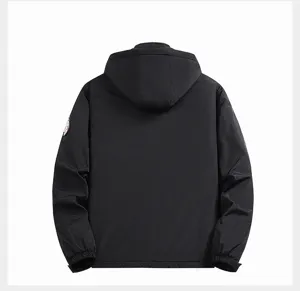 Back detail view of black winter hooded padded jacket featuring left sleeve round patch.
