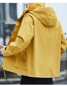 Detailed view of the yellow men's hooded windbreaker jacket showing zipper and pocket design.