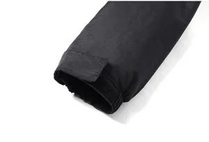 Men winter jacket sleeve detail, black windproof fabric with adjustable velcro cuff.