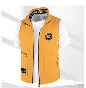 Detail view of men casual workwear vest in yellow, multi-pocket design with zipper.