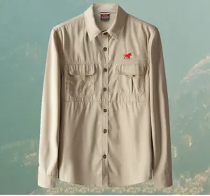 Men's khaki casual outdoor utility long sleeve shirt with classic dual chest pockets detail.