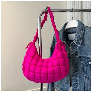 Hot pink quilted puffer shoulder bag, trendy cloud hobo handbag with elastic pleated strap.