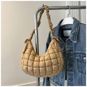 Beige quilted hobo shoulder bag with puffy design and gathered strap for women.