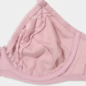 Detailed view of the pink plus-size French lace full cup bra showing soft lining.