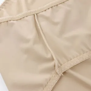 Close-up detail of women's seamless underwear fabric, stitching, and elastic waist.