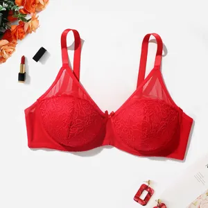 Detailed view of the red lace unlined bra, showing delicate floral lace texture and straps.